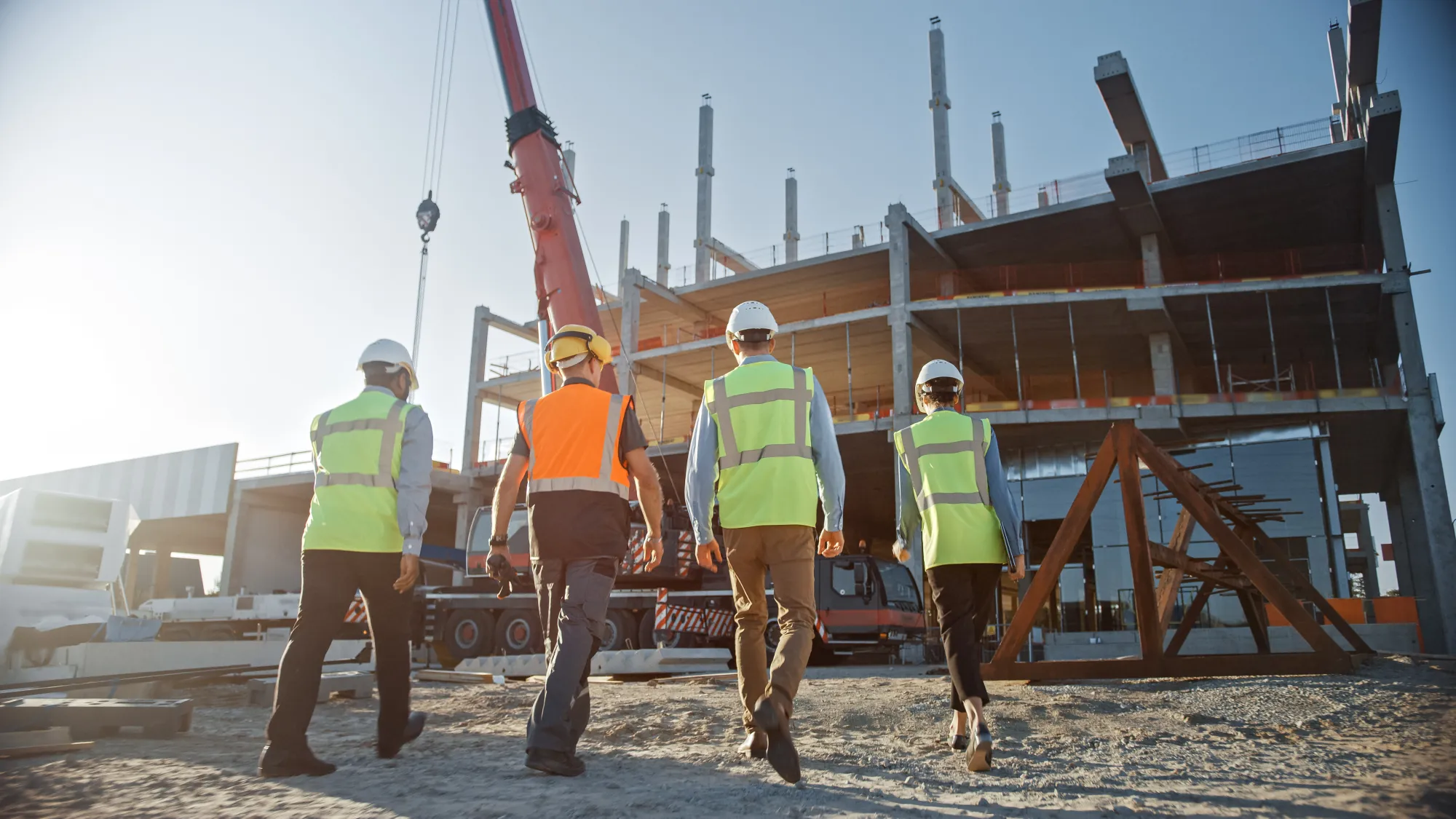 A development team walking a site under construction